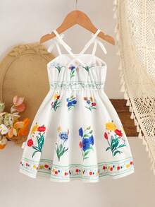 SHEIN Vestido avental infantil com estampa floral, tecido leve e macio, alças com laço, estampa floral colorida, amarração na cintura, modelagem solta e fluida, ideal para piqueniques ao ar livre, brincadeiras no jardim e para a primavera/verão. - Branco - Ver 2