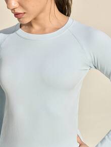 Exploreva Damska koszulka sportowa z długim rękawem w jednolitym kolorze, bezszwowa koszulka z długim rękawem i okrągłym dekoltem, damska koszulka fitness o dopasowanym kroju z długim rękawem - Niebieski - Zobacz 3
