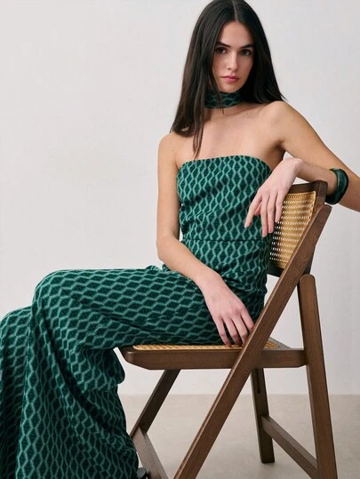 Nöista Off Shoulder Jumpsuit With A Geometric Jacquard Fabric, Fitted Bodice, Wide-Leg Pants And Matching Choker On Neck. Spring, Summer, Wedding Occasion, Formal Event, Easter.