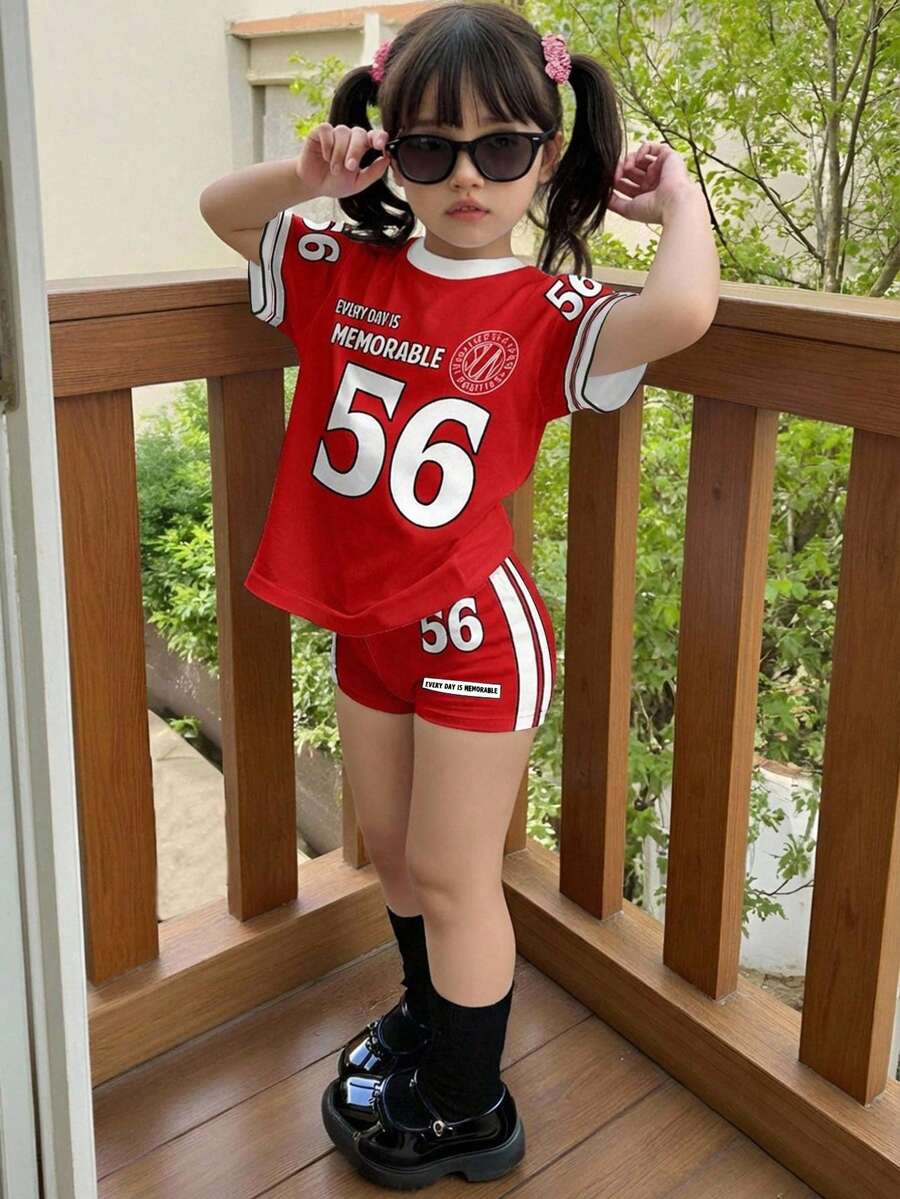 两件套女孩旅行休闲运动风套装,包含一件印有56号图案、“每一天都值得纪念”标语、撞色袖子和撞色领口的短袖T恤和一条骑行短裤,适合夏季、运动、健身、休闲外出和社交活动。 - 彩色 - 查看 1