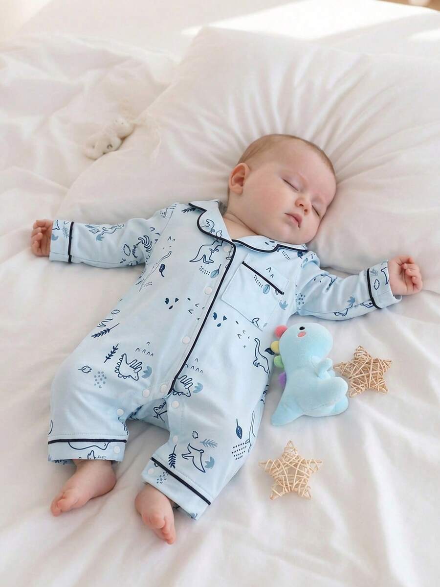 SHEIN Vintaside Kids Pijama de una pieza para recién nacidos e infantes, con estampado de dinosaurios de dibujos animados y cordón, de tela suave y cómoda - Azul - Ver 1