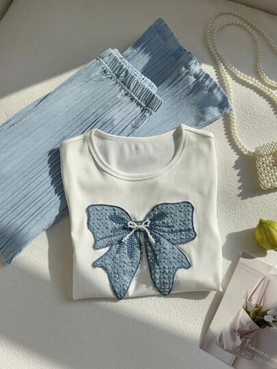 SHEIN طقم ملابس علوية وبنطلون للفتيات المراهقات، ملابس علوية كم قصير بياقة دائرية مطرزة بفيونكة، مقترنة ببنطلون كارجو ذو سيقان واسعة ملمس، مناسب لإطلالة الفتيات في الربيع والصيف