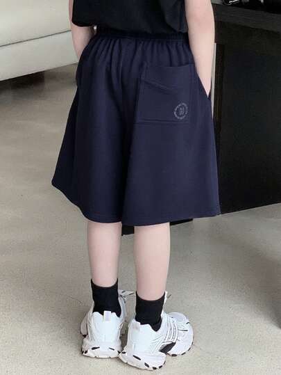 Dazy Kids Quần short ống rộng, màu trơn, cạp chun, có túi, dáng rộng, thoải mái, thích hợp cho bé trai tuổi teen.