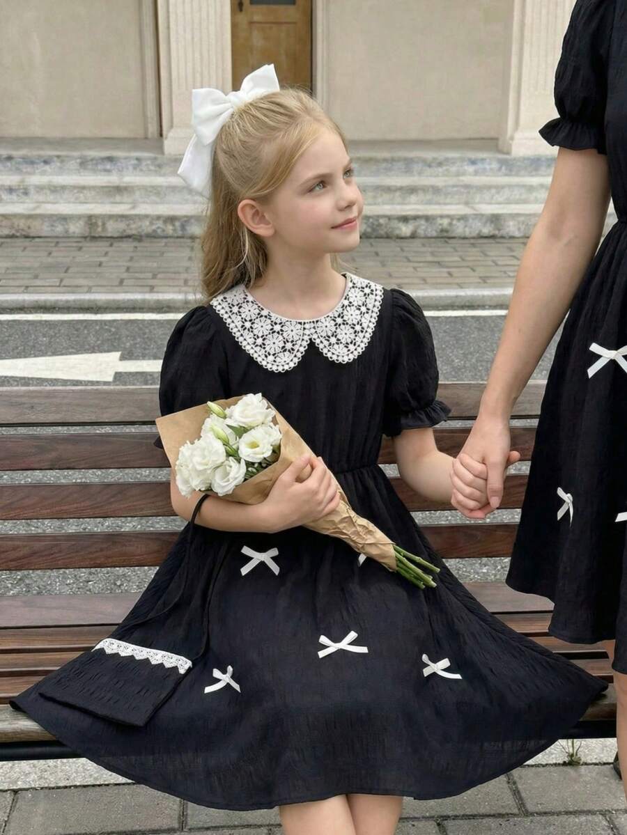 SHEIN This Is A Mid-Length Dress For Girls, In A Style Featuring Lace Ruffles At The Neckline, A One-Shouldered Design, And Puffed Sleeves. It Comes With A Cross-Body Bag And Is Perfect For Girls To Wear In Daily Casual Occasions Or For Sweet And Charming Vacation Outfits In The Summer. - Black - View 1