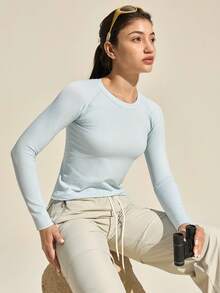 Exploreva Damska koszulka sportowa z długim rękawem w jednolitym kolorze, bezszwowa koszulka z długim rękawem i okrągłym dekoltem, damska koszulka fitness o dopasowanym kroju z długim rękawem - Niebieski - Zobacz 2