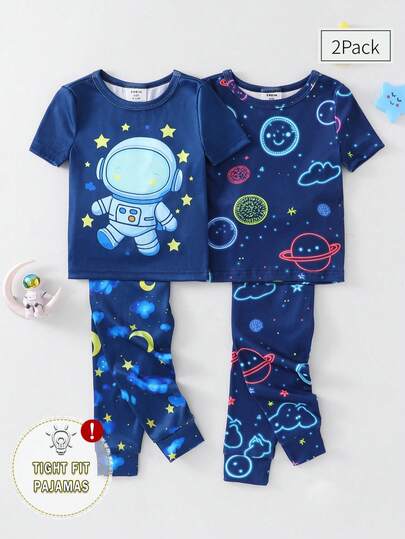 男婴四件套贴身睡衣套装，夜光宇航员卡通星空印花长袖上衣和裤子，舒适家居服。本产品需紫外线照射才能发光。
