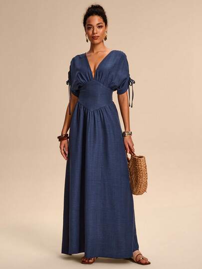 Breezaya Elegant Denim Blue V-Neck A-Line Maxi Dress With A Tie And Bow, This Versatile Design Is Perfect For Outings, The Beach, Music Festivals, And Spring/Summer Wear. Elegant Dresses For Women, Vacation Outfits, Summer Dress, Beach