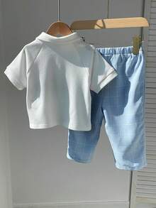 SHEIN 两件套男宝宝春夏学院风菱格纹短袖Polo衫及蓝色格子裤绅士套装，适合生日派对、锐舞派对、晚宴、演出、婚礼、迎婴派对、一周岁生日庆祝等场合。 - 彩色 - 查看 3