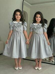 Vestido lindo con cuello Peter Pan, mangas cortas abullonadas y decoración de lazo para niña preadolescente con bloques de color - Verde - Ver 1