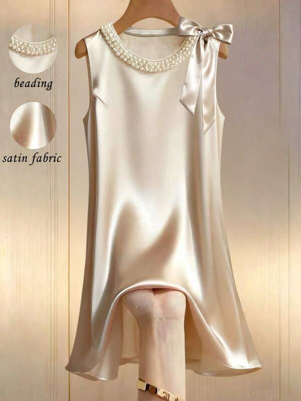 Franclia Đầm satin cổ tròn màu trơn, đính ngọc trai, kiểu dáng thanh lịch, không tay, thắt nơ bông.