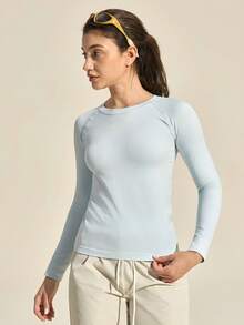 Exploreva Damska koszulka sportowa z długim rękawem w jednolitym kolorze, bezszwowa koszulka z długim rękawem i okrągłym dekoltem, damska koszulka fitness o dopasowanym kroju z długim rękawem - Niebieski - Zobacz 5