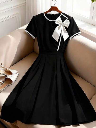 GlowEve Vestido midi de manga corta negro y blanco con lazo decorativo, corte evasé y ribete de contraste en la cintura, elegante para uso diario, vacaciones, trabajo, San Valentín, citas, estilo francés retro y versátil para principios de primavera/primavera-verano