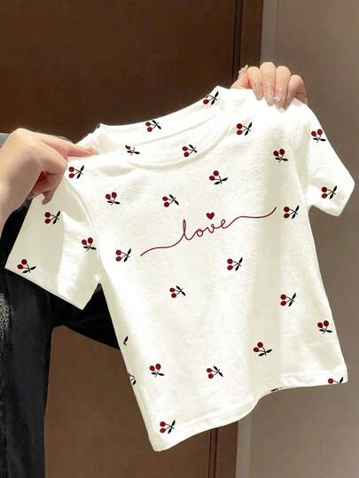 SHEIN Cute Ballet-Inspired Mini Cherry Print, Handwritten Love Letter, Chic & Elegant Korean Style, Young Girl Casual Minimalist Round Neck Short Sleeve T-Shirt, Suitable For Summer, Cute Summer Outfits, Summer Kids Items, Summer Outing Items, Korean Style, Homecoming, Easy Comfort & Stylish Kids, Spring & Summer Outfits, Casual Wear, Baby & Kids Graphic Tops, Summer New Style, Spring & Summer Fashion