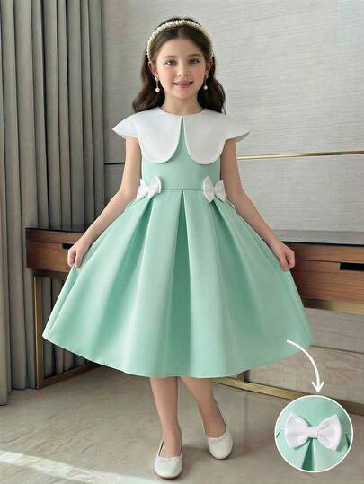 SHEIN Sweet Girly Style: Sleeveless Dress For Little Girls, With An Extra-Large White Peter Pan Collar That Exudes Cuteness And Playfulness. Delicate Three-Dimensional Bow Decorations Add A Touch Of Princess Charm, While The Loose Skirt Flows Gracefully And Lightly.
