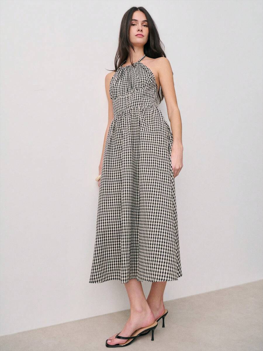 Nöista 黑白格纹吊带连衣裙，收腰设计，裙摆飘逸及膝。适合春季、夏季、女性穿着，也适合复活节等场合。 - 黑色 - 查看 1