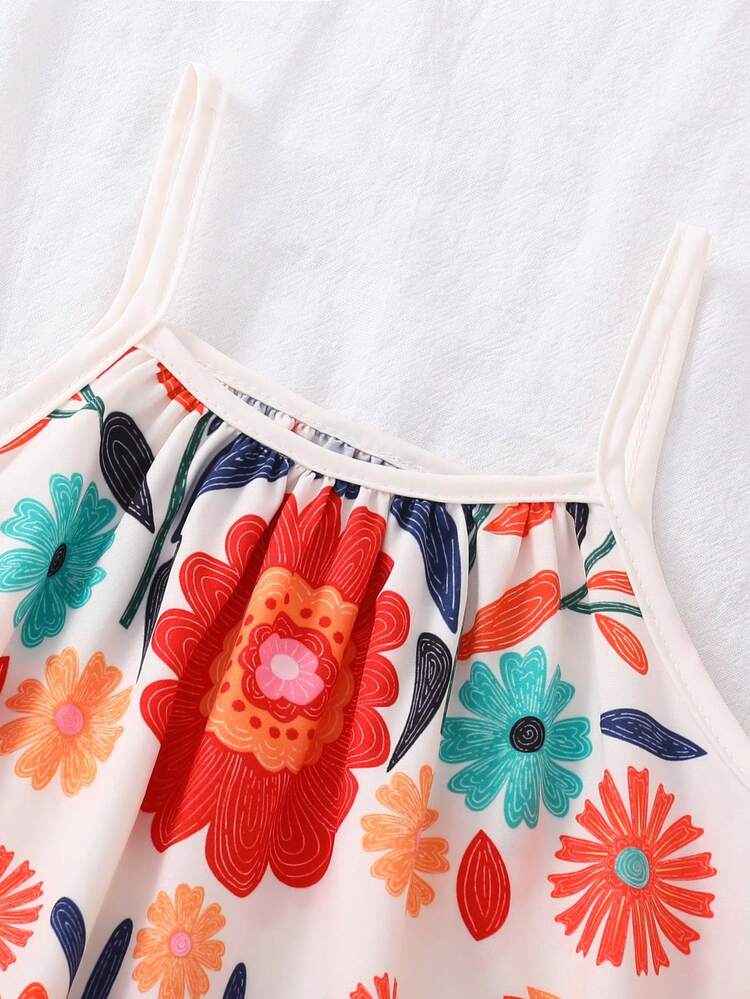 Đầm chữ A hai dây in hoa mùa hè cho bé gái, màu kem chủ đạo với họa tiết hoa rực rỡ, dây đeo mảnh, dáng suông thướt tha, thiết kế hoa văn dân gian Bohemian, chất liệu nhẹ, thích hợp cho mùa hè đi biển/nghỉ lễ. - Nhiều màu - Xem 6