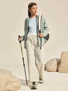 Exploreva Damska koszulka sportowa z długim rękawem w jednolitym kolorze, bezszwowa koszulka z długim rękawem i okrągłym dekoltem, damska koszulka fitness o dopasowanym kroju z długim rękawem - Niebieski - Zobacz 7