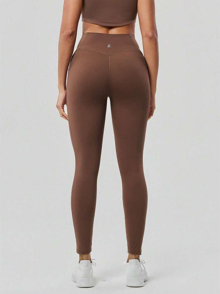 OutZeal 女士吸汗中度压缩交叉腰侧口袋紧身裤，适合日常健身和普拉提 - 棕色 - 查看 10