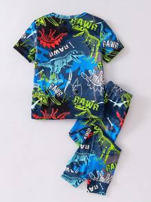 Conjunto de pijama de manga corta ajustado que brilla en la oscuridad con gráfico de dinosaurio y neón para niño pequeño, estampado aleatorio - Multicolor - Ver 3