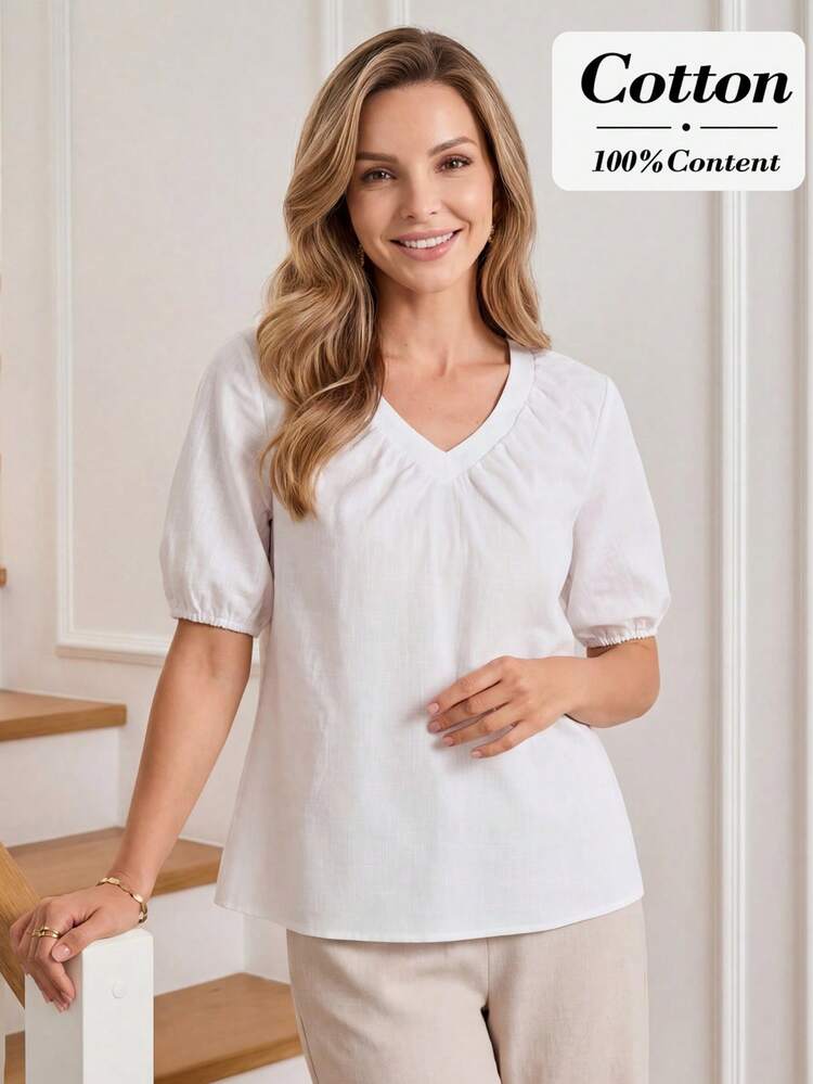 This Women's Casual Spring/Summer Shirt Features A Pure White Color, Exuding A Refreshing Feel And Serving As A Versatile Base For Stylish Looks. The Floral Pattern Is Crafted From Textured Fabric With A Simple Cut, Revealing A Subtle Yet Refined Quality. The V-Neck And Puff Sleeves Create A Relaxed Silhouette, While The Ruffled Neckline Adds A Touch Of Femininity, And The Voluminous Sleeves Add A Lively And Dynamic Touch. Perfect For Spring And Summer, This Shirt Is Suitable For Both Work And Casual Outings. Its Pure White Base Conveys A Fresh Style, While The Puff Sleeves Showcase A Fashionable And Light Taste, Making It A Top Choice For Your Spring/Summer Wardrobe, Combining Comfort And Style.