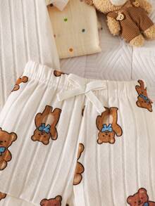 SHEIN Bộ 2 món cho trẻ sơ sinh: Áo liền quần tay ngắn kẻ sọc gân + Quần short in hình gấu, mềm mại và thoải mái để mặc hàng ngày. - Màu be - Xem 6