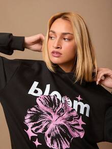 Áo nỉ nữ dáng rộng, in họa tiết, màu đen. - màu đen - Xem 1