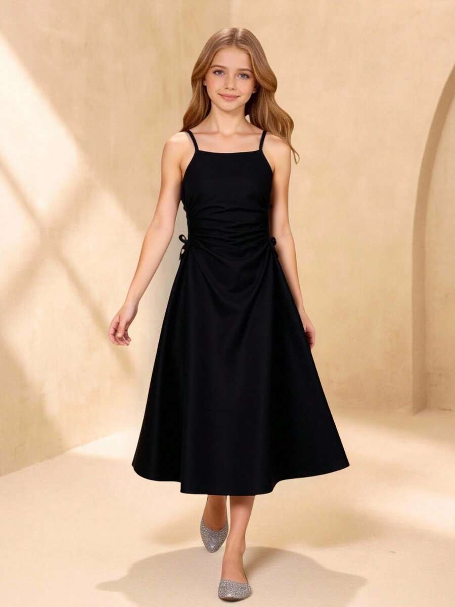Vestido casual y elegante para niñas preadolescentes con tirantes de espagueti y diseño de cintura ajustada con lazo, adecuado para uso diario, fiestas y eventos - Negro - Ver 1