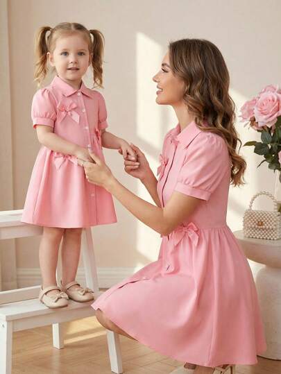 Elladie kids Girls Puff Sleeve Asymmetric Shirt Dress, Bow Decor, Fashionable And Sweet, Suitable For Daily Wear, Summer, New Arrival Girls Dresses With Buttons Kids Dress With Short Sleeves Girl Elegant Dresses Party Dress For Young Girls Elegant Pink Bow Girls Dress Collared Puff Sleeve Dress Mom Daughter Matching Dress Preppy Dress Kids Girls Pink Dress Pink Bow Dress Kids Preppy Dress Pink Dress With Bows Pink Bow Collared Dress Girls Pink Puff Sleeve Dress