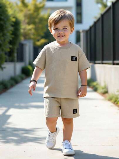 SHEIN Streecool Kids 2pcs/Set Young Boy Casual Letter Patch Textured Short Sleeve T-Shirt And Shorts Set, Summer