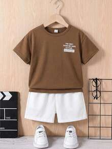 Genkimix Kids Bộ áo thun ngắn tay và quần short dáng rộng thoải mái cho bé trai, áo màu nâu, quần màu trắng phối tương phản, in khẩu hiệu tiếng Anh "ALWAYS BE YOURSELF" (Luôn là chính mình), phong cách đường phố Mỹ thời trang, thích hợp mặc hàng ngày vào mùa hè, đi học, đi chơi với bạn bè. - màu nâu - Xem 6