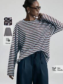 Ontre Áo kiểu nữ hai tông màu be và xanh dương, chất liệu mềm mại, thoải mái, dáng rộng, vai rớt, tay dài, phong cách thường ngày, đa năng, hiện đại, thanh lịch, phù hợp cho công sở, trang phục công sở, vẻ đẹp tinh tế, chất lượng cao, thiết kế tối giản, thoải mái, thuộc dòng sản phẩm phong cách đô thị. - Nhiều màu - Xem 3