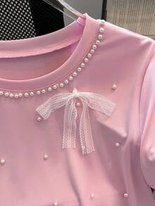 SHEIN Franclia 女士纯色情人节粉色蕾丝蝴蝶结珍珠装饰甜美Y2K风格短袖T恤，面料柔软舒适，适合夏季、春季穿着，粉色系，可作沙滩装、派对装、婚礼及活动上衣、生日礼物、外出装、优雅女式衬衫、度假装、休闲女式衬衫，适合约会、日常穿着、通勤等场合，百搭时尚，休闲粉色蝴蝶结上衣，婴儿粉上衣，粉色T恤，少女风上衣，粉色Y2K上衣 - 粉色 - 查看 6