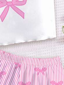 SHEIN Bộ đồ ngủ 2 món cho bé gái, màu hồng dễ thương với nơ và họa tiết sọc, gồm áo hai dây và quần short, thích hợp cho mùa hè, phong cách Y2K. - Nhiều màu - Xem 5