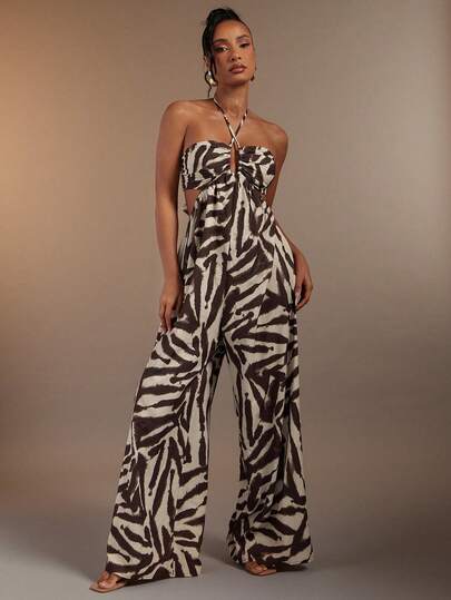 Hauture Sexig jumpsuit i linne med abstrakt tryck och utskuren framsida, korsad halterneck och öppen rygg.