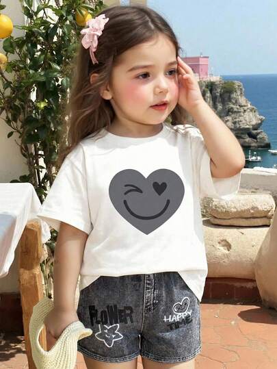SHEIN 2pcs/Set Young Girl Casual Loose Heart & Face Graffiti Print Short Sleeve Round Neck T-Shirt And Shorts Set, Suitable For Summer, Suitable For Home, Outing, Street Photography, Campus