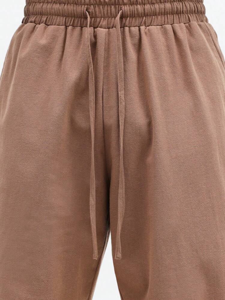 Spodnie polo z lnianej tkaniny z szerokimi nogawkami