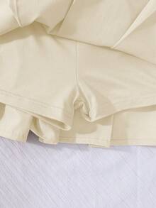 SHEIN Chân váy xếp ly cạp cao cho bé gái, có quần bảo hộ bên trong, kiểu váy quần 2 trong 1, đa năng cho mọi mùa, có thể phối cùng áo sơ mi, áo phông, áo polo, áo hoodie, áo khoác. - Màu be - Xem 5