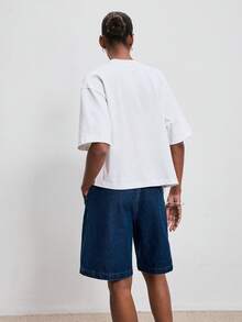 ATUI Studio T-shirt à manches courtes asymétrique blanc minimaliste, silhouette ample avec design fendu confortable. Top casual adapté pour les déplacements quotidiens, les vacances et les sorties - Blanc - Voir 4