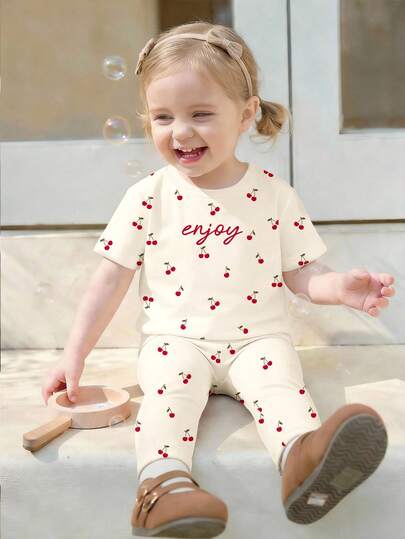 SHEIN Cream White, Cute Mini Cherry Minimalist Sweet Letter Pattern, Baby Girl Casual Loose Round Neck Short Sleeve T-Shirt And Leggings Set, Suitable For Spring/Summer Daily Wear, Farm, Picnic, Outing, Home, Vacation