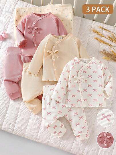 SHEIN 3件套新生女宝宝甜美套装，春夏款，白色蝴蝶结印花+杏色/粉色长袖上衣和裤子，罗纹柔软亲肤面料，前斜襟设计配蝴蝶结装饰，方便日常外出或玩耍时穿脱