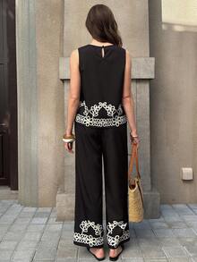 Solivie Bộ đồ nữ thanh lịch gồm áo kiểu xếp ly màu trơn có họa tiết và quần ống rộng họa tiết hoa. - màu đen - Xem 2