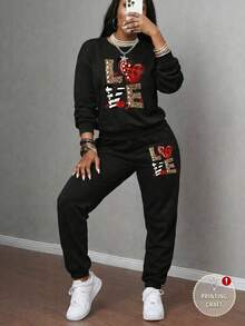 Rovax 2 pezzi Set di felpa girocollo e pantaloni della tuta casual da donna con stampa di lettere e cuori, autunnale - nero - Visualizzare 1