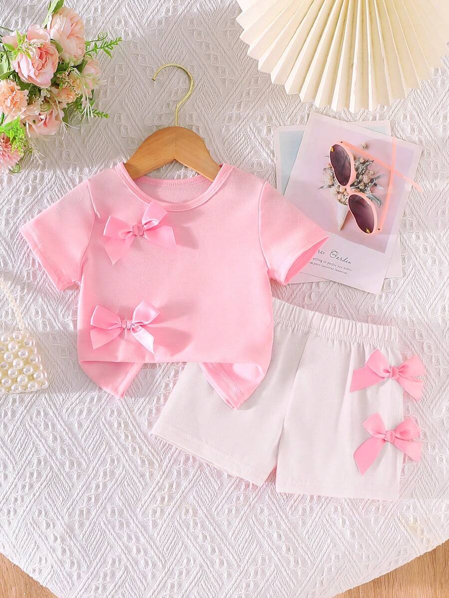 SHEIN Playful Pals 女婴休闲时尚日常圆领短袖露脐蝴蝶结装饰粉色T恤和松紧腰短裤两件套