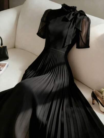 GlowEve CURVE Vestido maxi negro de talla grande con cuello redondo, lazo, mangas abullonadas, parches de malla y pliegues en la cintura