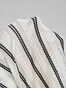 Ontre 2026春夏新款女士两件套，黑白竖条纹针织镂空Polo领上衣搭配松紧腰裤，现代优雅的婚礼宾客装扮，简约浪漫的法式奢华都市时尚商务休闲办公服饰，低调奢华的质感，都市通勤、机场、邮轮、中东旅行必备单品，四季皆宜的高级婚礼系列女士两件套。 - 黑與白 - 查看 9