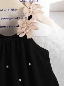 Đầm bé gái dáng rộng màu đen, chất liệu vải nhăn, không tay, họa tiết hoa 3D, đính cườm phía trước, vạt áo rộng, thích hợp cho kỳ nghỉ biển. - màu đen - Xem 5