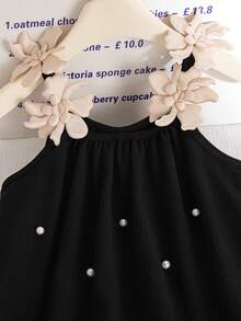 Đầm bé gái dáng rộng màu đen, chất liệu vải nhăn, không tay, họa tiết hoa 3D, đính cườm phía trước, vạt áo rộng, thích hợp cho kỳ nghỉ biển. - màu đen - Xem 6