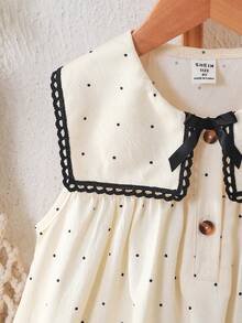 SHEIN 女童休闲波点连衣裙，饰有可爱蝴蝶结蕾丝边，方领开襟设计，适合日常休闲、度假、通勤等场合，尽显优雅气质。 - 杏色 - 查看 9