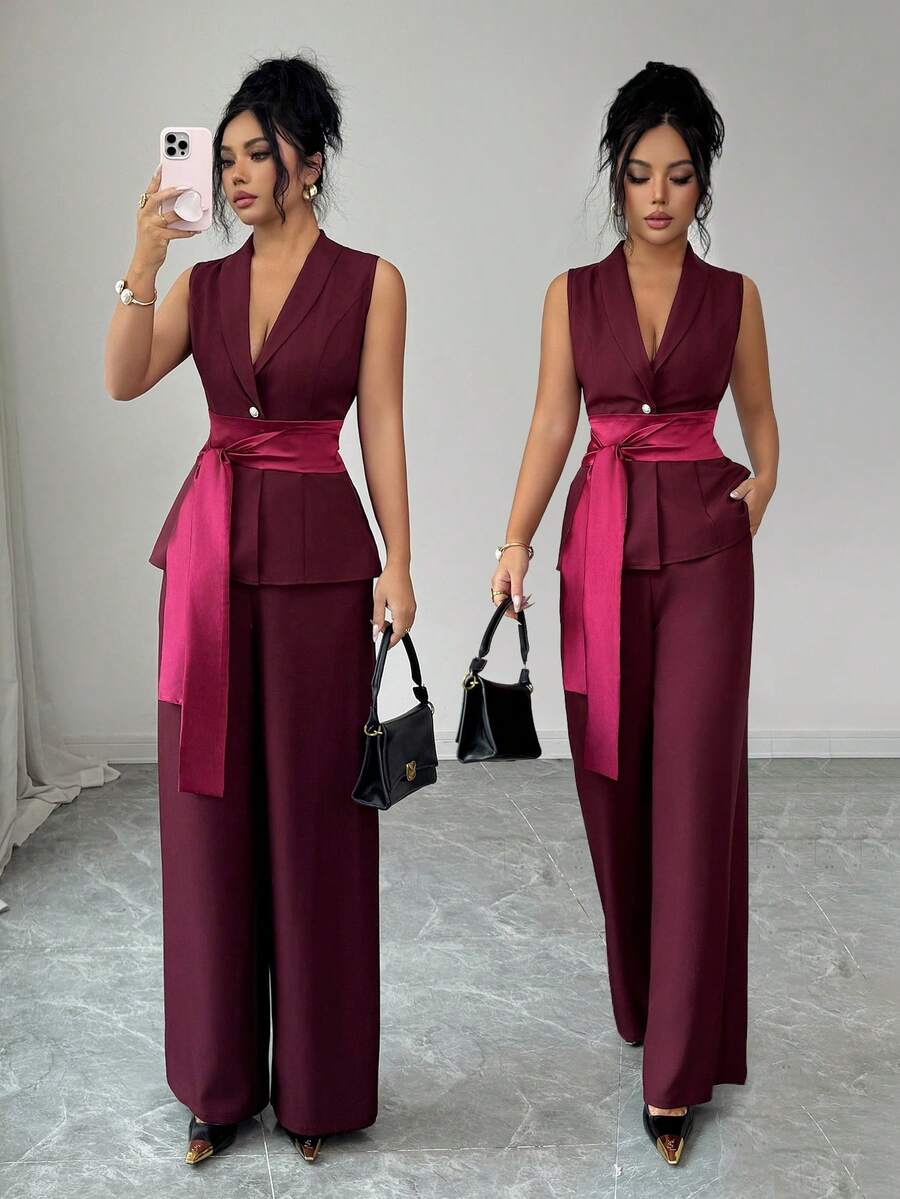 Elenzga Bộ trang phục thanh lịch và tinh tế dành cho nữ, gồm áo sơ mi không tay cổ chữ V màu đỏ tía, cài một hàng khuy, có thắt lưng, kết hợp với quần ống rộng. Thích hợp cho sinh nhật, hẹn hò, tiệc tùng, các dịp trang trọng, tiệc cocktail, lễ hội âm nhạc, Ngày Valentine, Lễ Phục sinh, Ngày động, tiệc tựu trường, tiệc độc thân, và mùa xuân. - Màu đỏ tím - Xem 1
