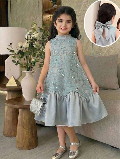 SHEIN فستان كاجوال بدون أكمام للفتيات الصغيرات مزين بزهرة ثلاثية الأبعاد وكشكشة وفيونكة من نسيج شبكي
